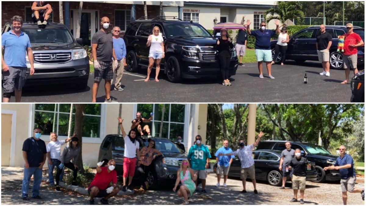 People waving using their masks and keeping their distance from a parking lot