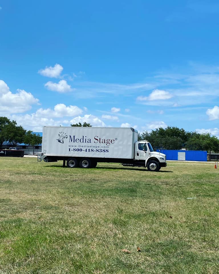 Media stage truck on a field